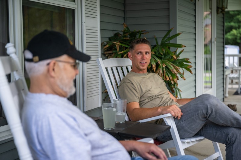 Senior veteran talking with son